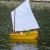 Not all of our sailboats are competition based.  This sailing Dinghy was scratch built by Admirals member Scott.  Kermit is at the tiller arm and his arm actually looks like it moves the rudder!  Whimsical and fun for all ages.  "Kermit's Dinghy" won a 1st Place at the Toledo RC Show!